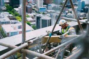 Man, welding, outdoors, repairing, building, daytime, skyscraper, work ...